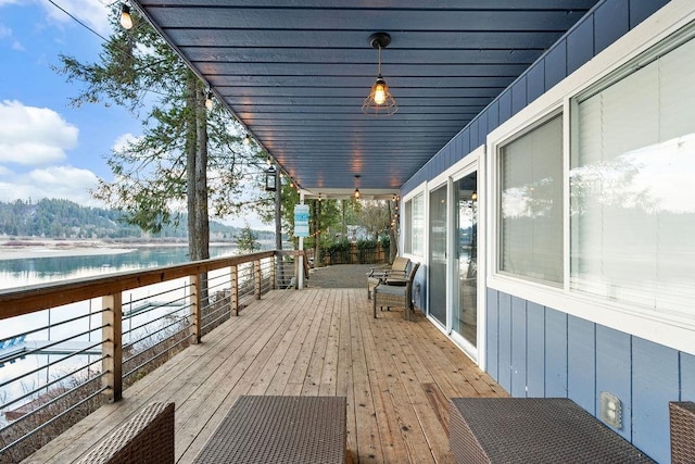 wooden deck with a water view