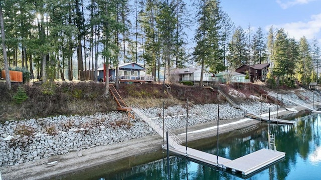 view of dock with a water view and stairway