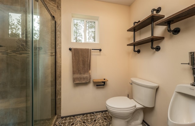 bathroom featuring tile patterned flooring, a stall shower, and toilet