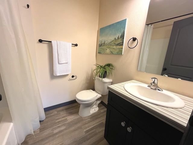 22410 S Ritchey Rd, Cheney, WA 99004 - full bath featuring wood finished floors, toilet, curtained shower, and vanity