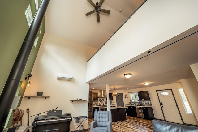 living room featuring ceiling fan and dark wood-style floors