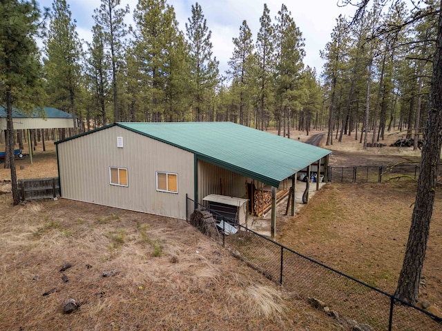 view of outdoor structure with fence