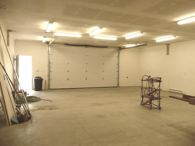 garage featuring baseboard heating