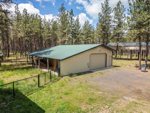 22410 S Ritchey Rd, Cheney, WA 99004 - view of outdoor structure with fence, an outdoor structure, and dirt driveway