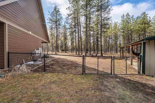 view of yard with fence and a gate