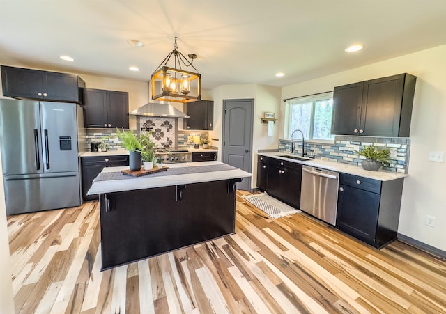 22410 S Ritchey Rd, Cheney, WA 99004 - kitchen featuring appliances with stainless steel finishes, a sink, light wood-type flooring, backsplash, and recessed lighting