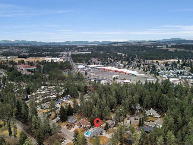 birds eye view of property with a mountain view