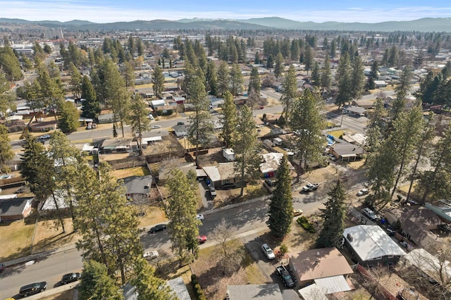 birds eye view of property with a mountain view