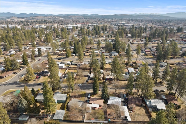 drone / aerial view featuring a residential view and a mountain view