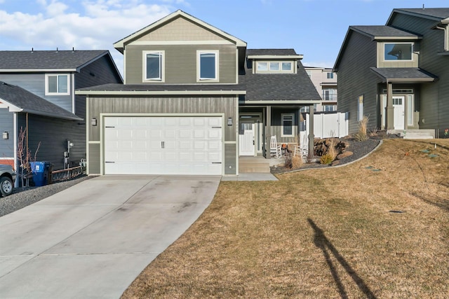 view of front facade featuring a front lawn and concrete driveway