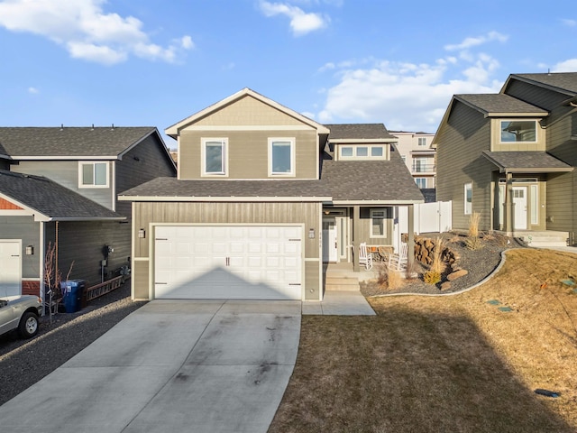 view of front facade with a shingled roof, driveway, an attached garage, and fence