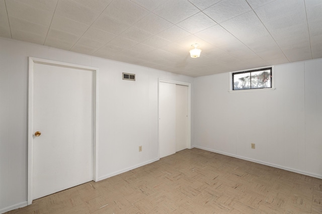 below grade area with visible vents and baseboards