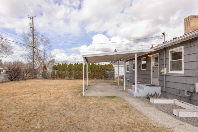 view of yard featuring a patio area and fence