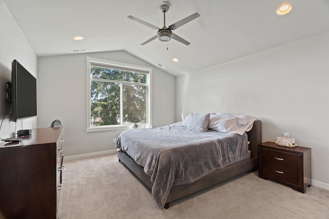 bedroom with light carpet, vaulted ceiling, visible vents, and baseboards