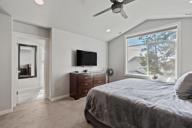 bedroom with light carpet, baseboards, lofted ceiling, ensuite bath, and recessed lighting