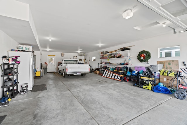 garage with freestanding refrigerator