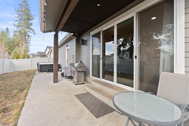 view of patio with grilling area and a fenced backyard