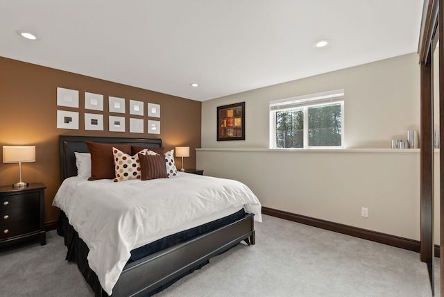 bedroom with recessed lighting, baseboards, and light colored carpet