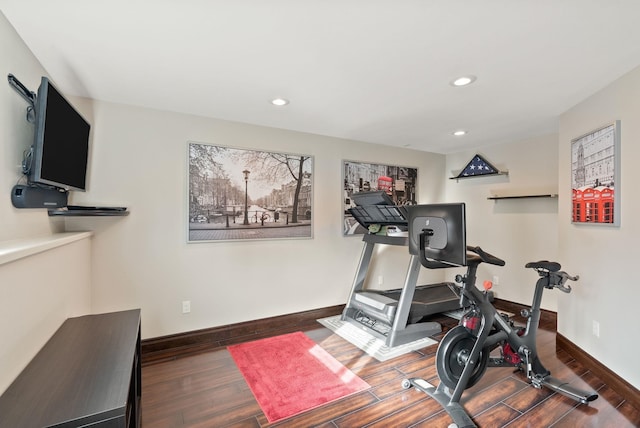 exercise room with recessed lighting, wood finished floors, and baseboards