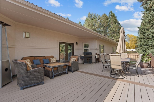 wooden terrace with an outdoor hangout area, grilling area, french doors, and outdoor dining space