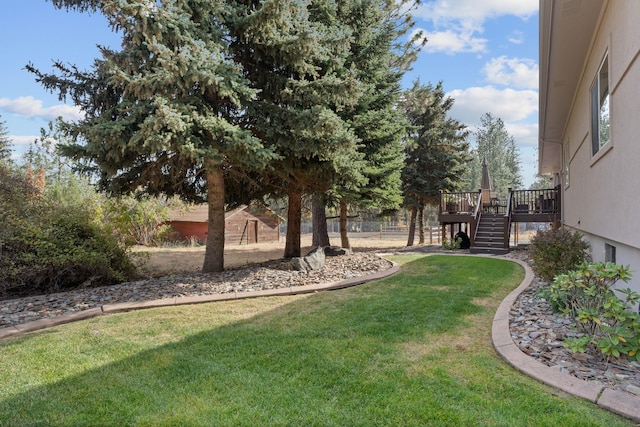 view of yard featuring stairway, fence, and a wooden deck