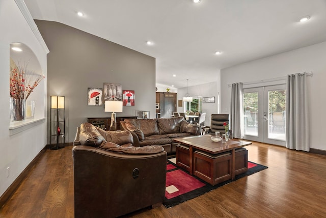 living room featuring dark wood-style floors, french doors, vaulted ceiling, and baseboards