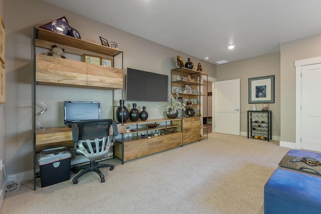 carpeted home office with baseboards