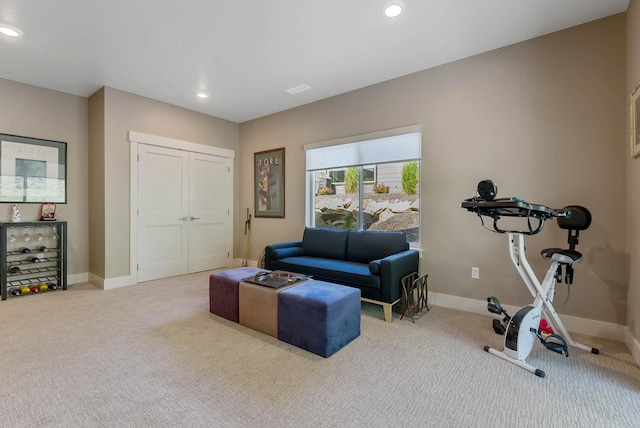 exercise room featuring carpet floors, recessed lighting, and baseboards