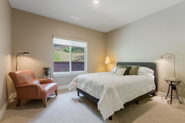 bedroom featuring carpet floors, baseboards, and visible vents