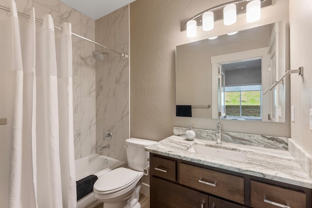 full bathroom featuring shower / bathtub combination with curtain, a textured wall, vanity, and toilet