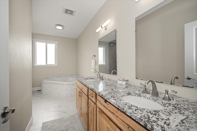 full bath with a healthy amount of sunlight, visible vents, a sink, and marble finish floor