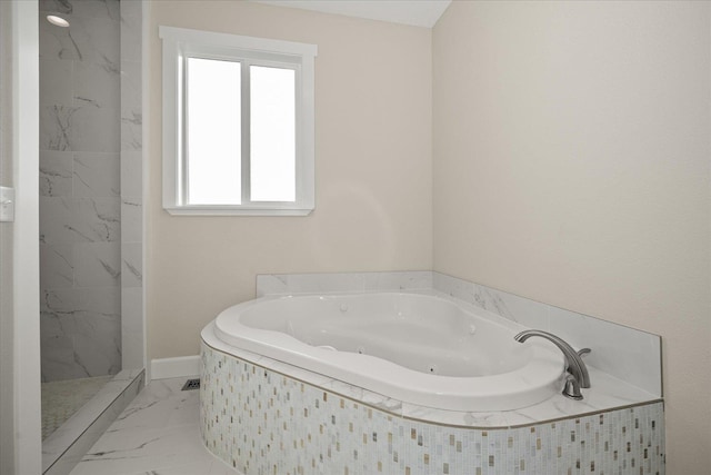 bathroom with marble finish floor, a jetted tub, and a marble finish shower