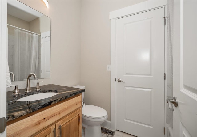 full bath with toilet, visible vents, and vanity