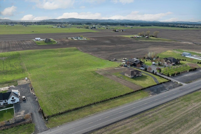 drone / aerial view featuring a rural view and a mountain view