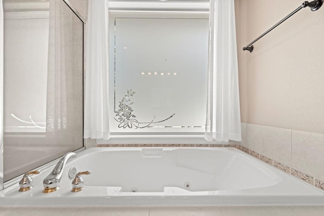 full bath featuring a jetted tub