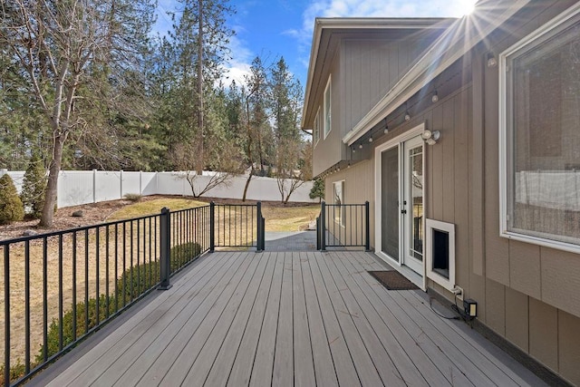 deck with a fenced backyard