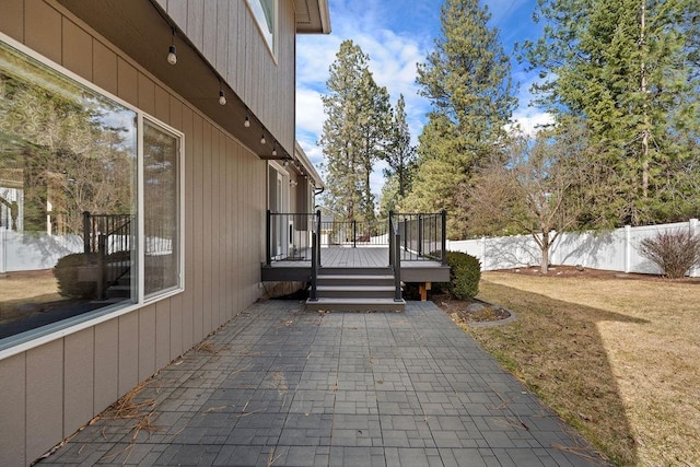 view of patio / terrace with a fenced backyard and a deck