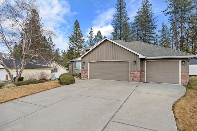 ranch-style home with a garage, driveway, brick siding, and a shingled roof