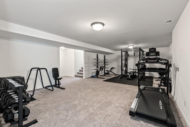 exercise room featuring carpet, visible vents, and baseboards