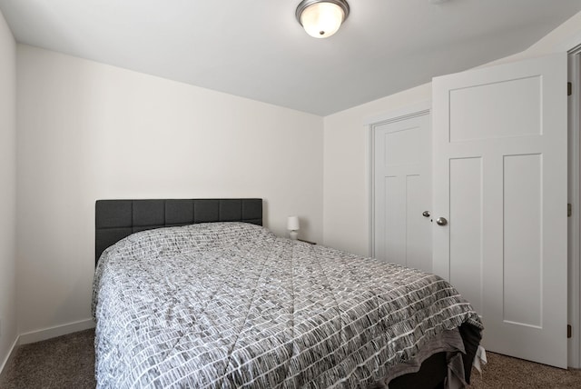 carpeted bedroom with baseboards