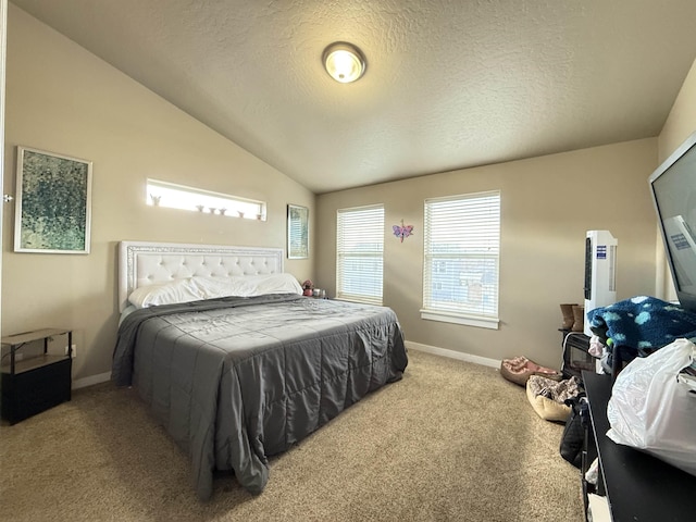 carpeted bedroom featuring baseboards, vaulted ceiling, and a textured ceiling