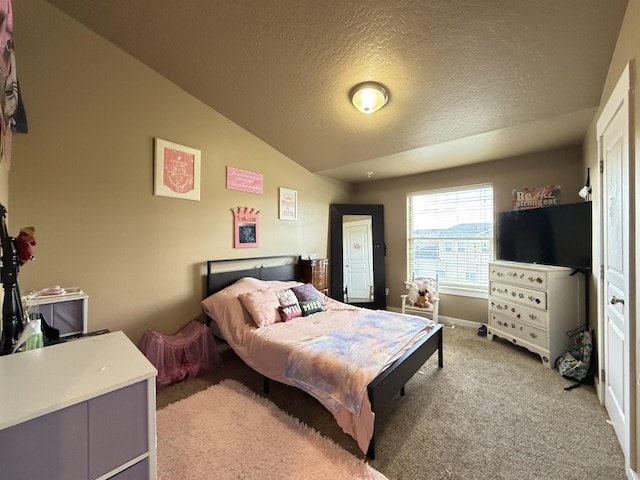 bedroom with baseboards, vaulted ceiling, a textured ceiling, and light colored carpet