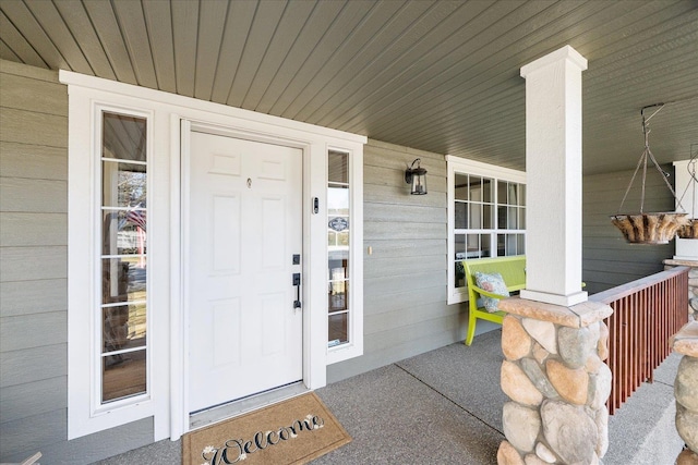 doorway to property with a porch