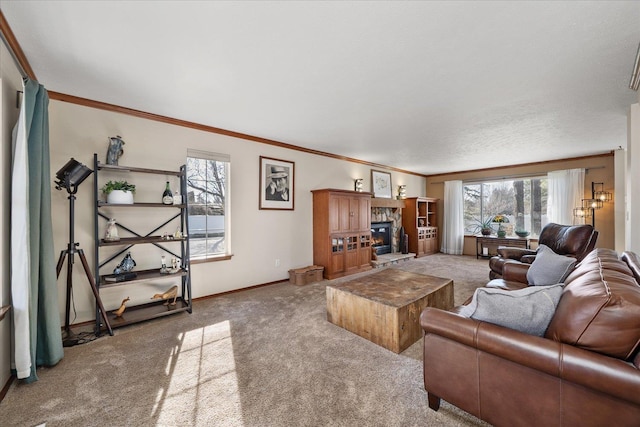 living area with carpet floors, crown molding, a fireplace, and baseboards