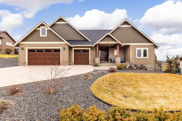 craftsman inspired home with a garage, driveway, roof with shingles, a front lawn, and board and batten siding