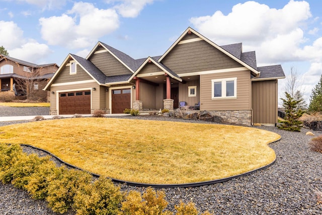 craftsman house with stone siding, roof with shingles, an attached garage, a front lawn, and board and batten siding