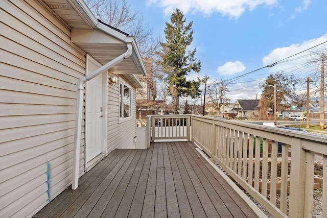 wooden deck with a residential view