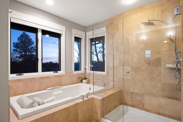 bathroom featuring tiled shower and a bath