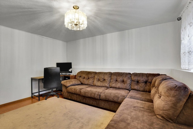 living room featuring a chandelier and wood finished floors