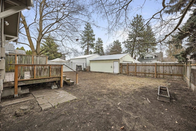 view of yard with an outdoor structure and a fenced backyard